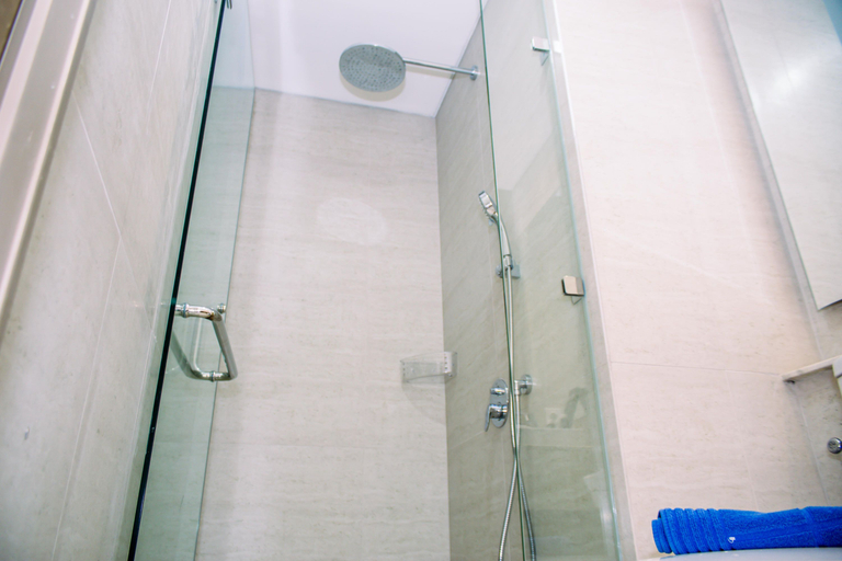 Bathroom 3, Fancy and Nice Studio at Gold Coast Apartment By Travelio, North Jakarta