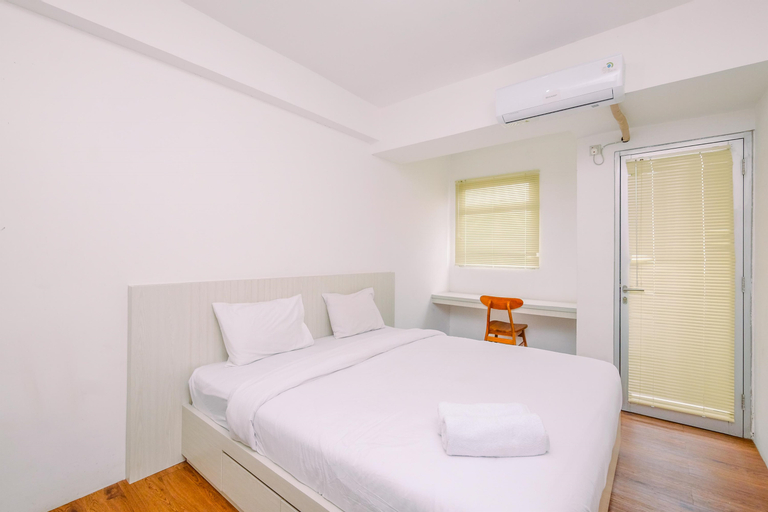 Bedroom 1, Cozy and Comfort Stay Studio Room at Gunung Putri Square Apartment By Travelio, Bogor