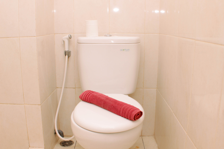 Bathroom 5, Cozy and Modern Studio at Springlake Summarecon Bekasi Apartment By Travelio, Bekasi