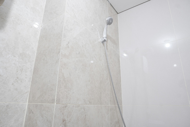 Bathroom 5, Nice Studio at 11th Floor Transpark Cibubur Apartment By Travelio, Depok