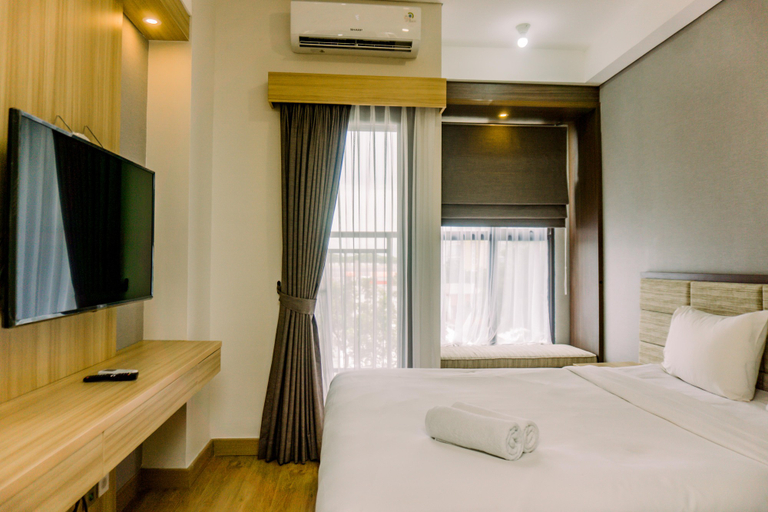 Bedroom 3, Minimalist and Warm Studio at Transpark Bintaro Apartment By Travelio, South Tangerang