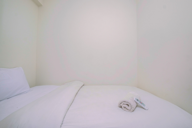 Bedroom 2, Homey and Warm 2BR at Podomoro Golf View Apartment By Travelio, Bogor