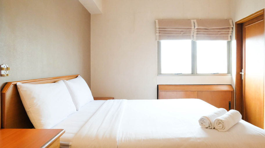 Bedroom 2, Extra Spacious and Homey 2BR at Kondominium Puncak Marina Apartment By Travelio, Surabaya