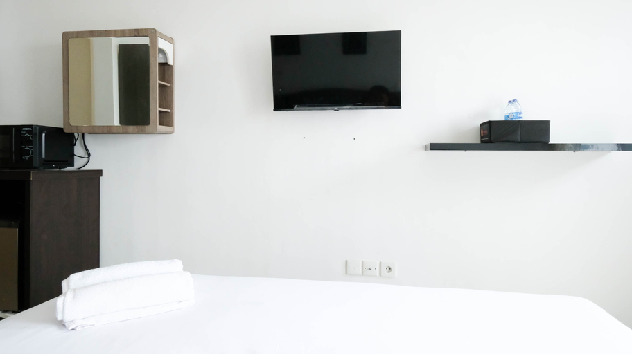 Bedroom 2, Comfy and Modern Studio (No Kitchen) at Orchard Supermall Mansion Apartment By Travelio, Surabaya