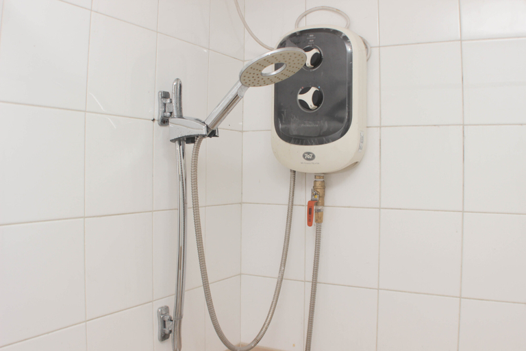 Bathroom 5, Cozy and Warm Studio (No Kitchen) at Metropark Condominium Jababeka Apartment By Travelio, Cikarang