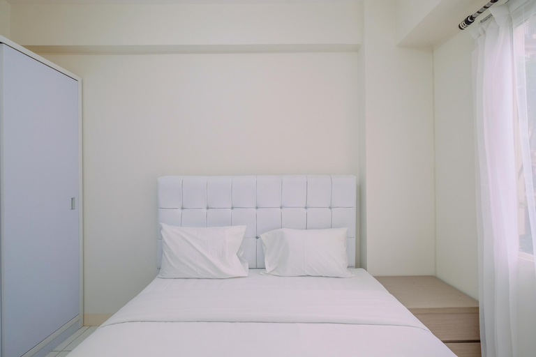 Bedroom 1, Comfy 2BR Apartment at Podomoro Golf View By Travelio, Bogor
