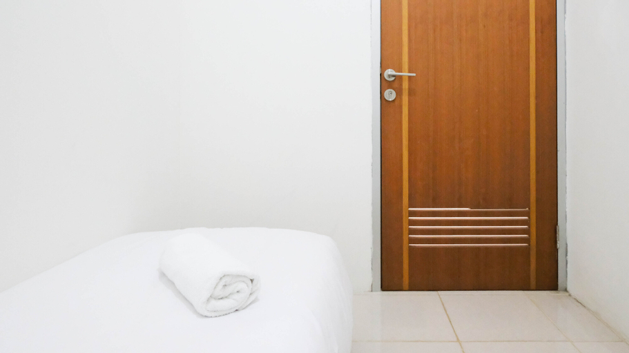 Bedroom 3, Nice and Tidy 2BR at Puncak Permai Apartment By Travelio, Surabaya