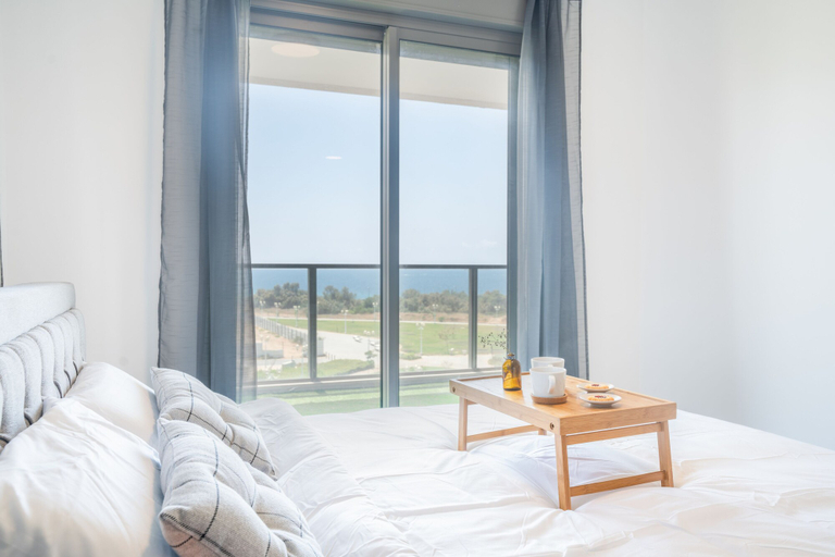 Bedroom 2, Vibrant Seaside Stay with Balcony by Sea N' Rent