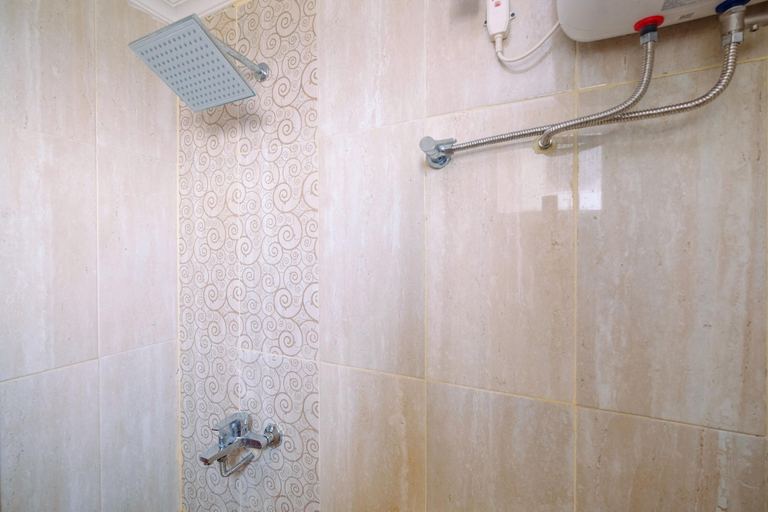 Bathroom 3, Minimalist 2BR Apartment at Green Park View By Travelio, West Jakarta