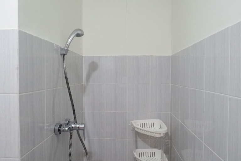 Bathroom 5, Exquisite 2BR Apartment at Puncak Dharmahusada By Travelio, Surabaya