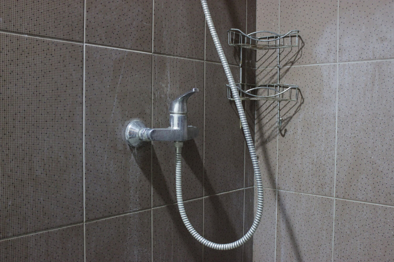 Bathroom 5, Bright Studio Room at Dago Suites Apartment near ITB By Travelio, Bandung