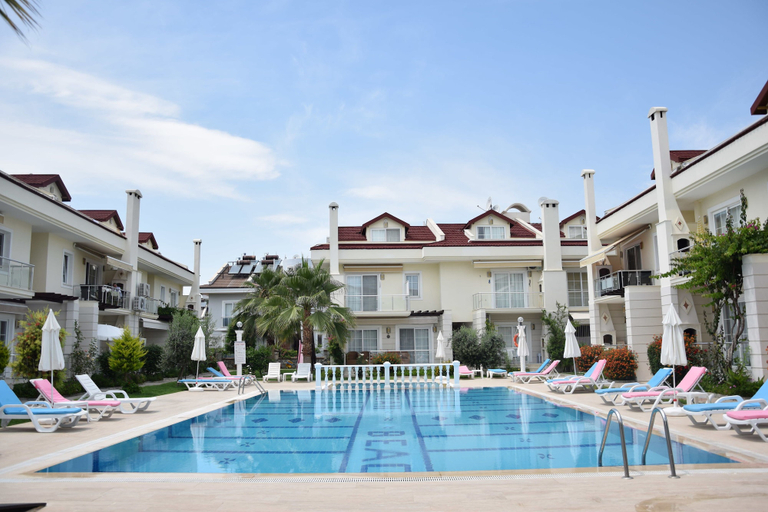 Outdoor pool, Ocean Beach Apartment by TurkishLettings, Fethiye
