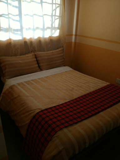 Bedroom 5, Coconut Palm Hotel, Kieni