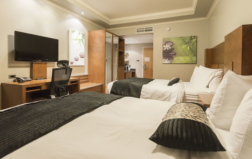 Bedroom 3, Hôtel & Suites Le Dauphin Drummondville, Drummond
