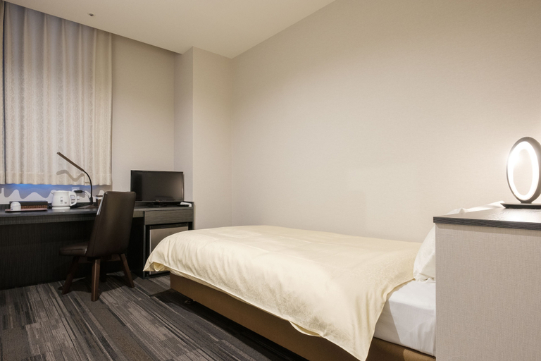 Bedroom 4, The Premium Hotel in Rinku, Tajiri