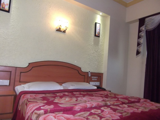 Bedroom 3, Hotel Ravikant, Pune