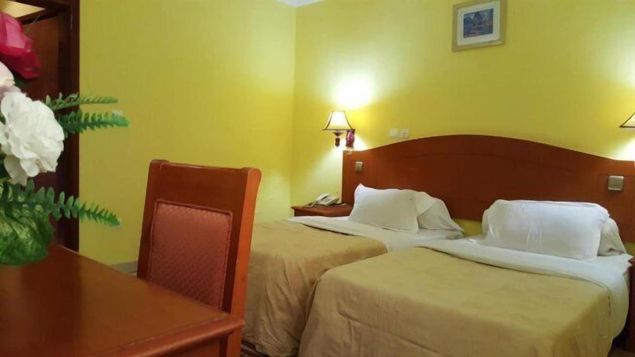 Bedroom 2, Peninsula Plaza Hotel, Wouri