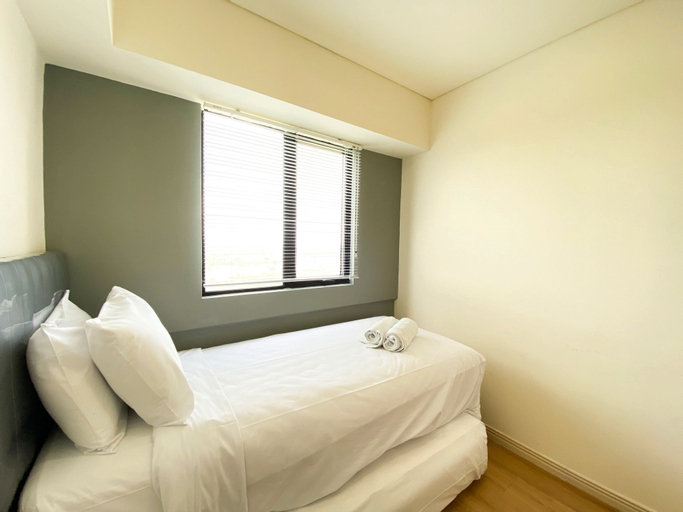 Bedroom 3, Comfort Living and Warm 3BR at Meikarta Apartment By Travelio, Cikarang