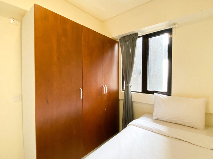 Bedroom 2, Restful and Tidy 2BR at 21st Floor Meikarta Apartment By Travelio, Cikarang
