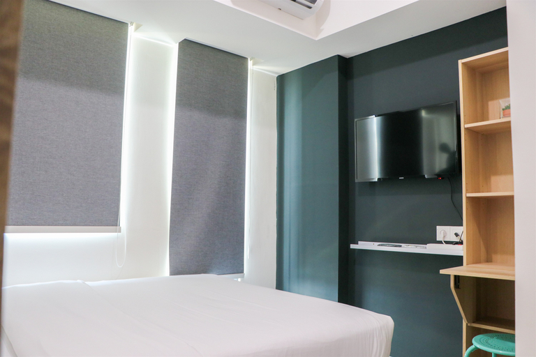 Bedroom 3, Tranquil and Minimalist Studio at Osaka Riverview PIK 2 Apartment By Travelio, Tangerang