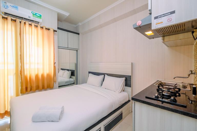 Nice and Homey Studio Room at Green Pramuka City Apartment By Travelio, Central Jakarta