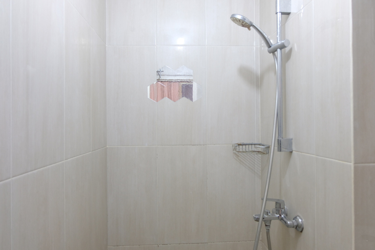 Bathroom 5, Spacious Studio with Extra Room at Grand Asia Afrika Apartment By Travelio, Bandung