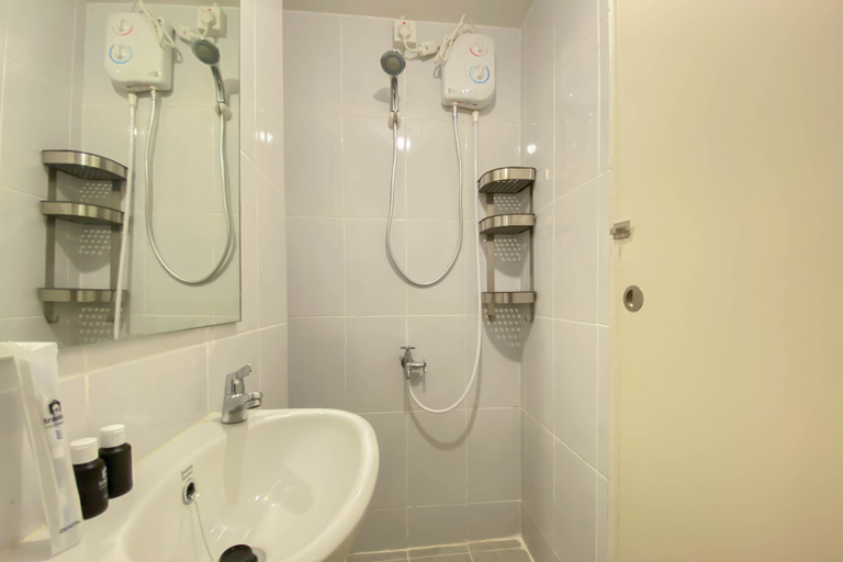 Bathroom 5, Nice and Compact Studio at Tokyo Riverside PIK 2 Apartment By Travelio, Tangerang