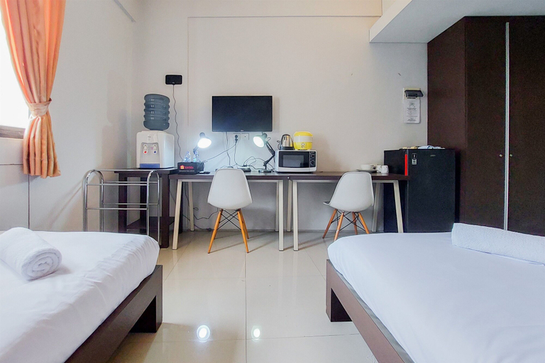 Bedroom 3, Warm and Cozy Studio (No Kitchen) at Kubikahomy Apartment By Travelio, Tangerang Selatan