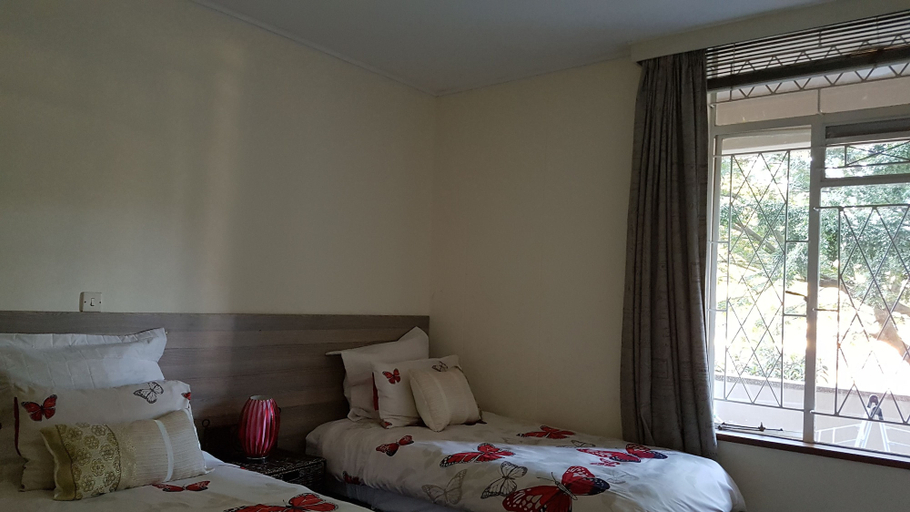 Bedroom 2, Lolos Elegant Three Bedroom Apartment, Harare