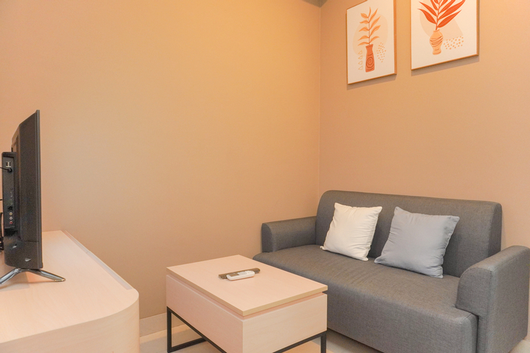 Living Room 3, Nice and Warm 1BR at Gold Coast Apartment By Travelio, North Jakarta