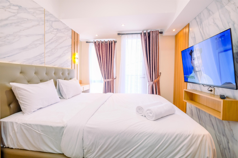 Bedroom 2, Warm and Cozy Studio at Tokyo Riverside PIK 2 Apartment By Travelio, Tangerang