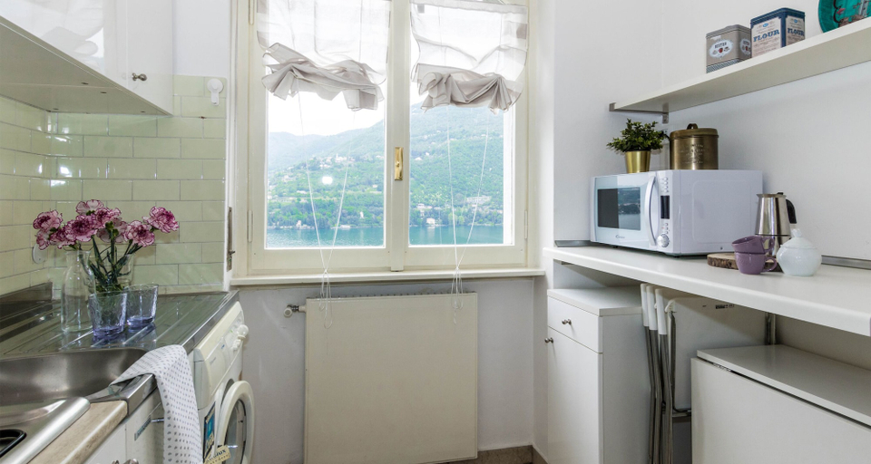 Others 4, JOIVY Garden Oasis: 1BR Apt w/ Balcony & Parking, Como