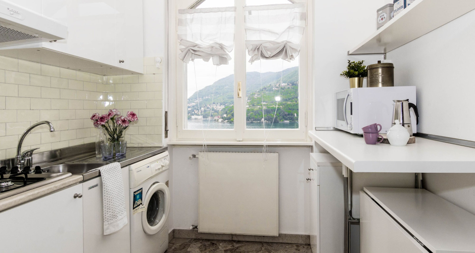 Others 5, JOIVY Garden Oasis: 1BR Apt w/ Balcony & Parking, Como