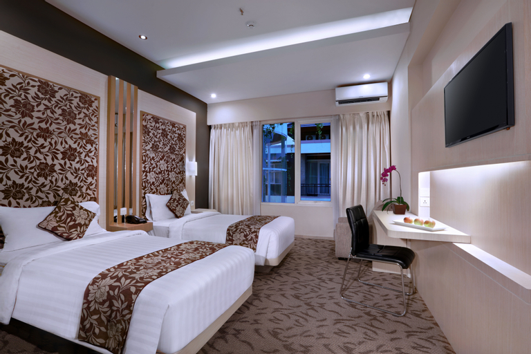 Quest San Hotel Denpasar by ASTON - Tap to explore photos