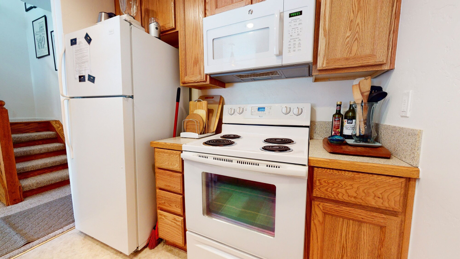 Private kitchen 2, Summit 293 Bright, Spacious with Under Ground Parking, Walk to Eagle Lodge by RedAwning, Mono