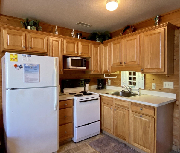 Private kitchen, 11 Mystical Sundaze Studio Bedroom Condo by RedAwning, Dare