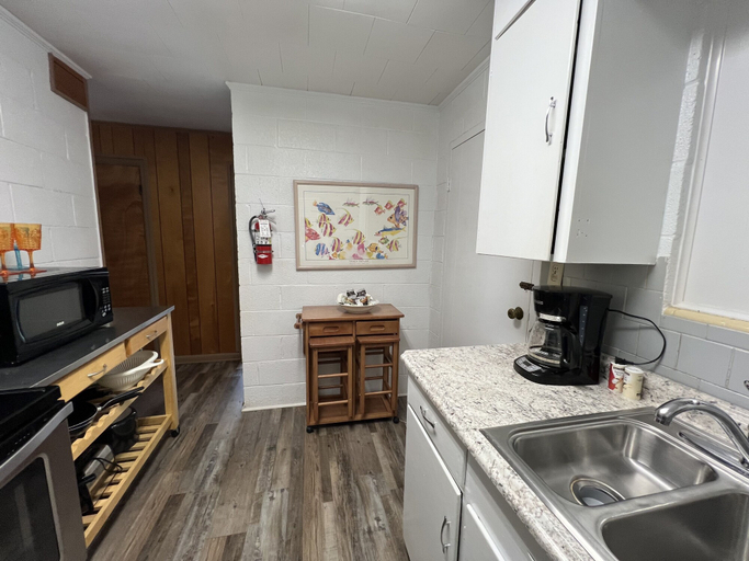 Private kitchen 5, Budget friendly queen studio with full kitchen, two queen beds and sleeper sofa by RedAwning, Montgomery