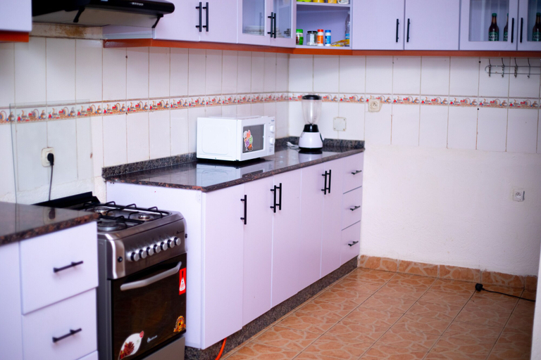 Private kitchen, Inviting 6-bedrooms Apartment in Kigali, Gasabo