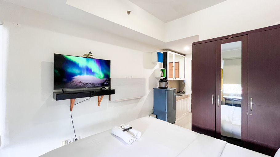 Bedroom 4, Simply Design Studio Apartment at Vida View Makassar By Travelio, Makassar