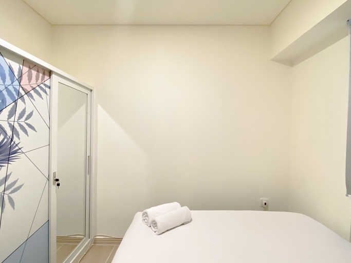 Bedroom 2, Restful and Modern Look 2BR at Meikarta Apartment By Travelio, Cikarang