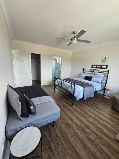 Book a spacious queen room with your own ensuite for your stay with shared laundry kitchen and livin, Holroyd