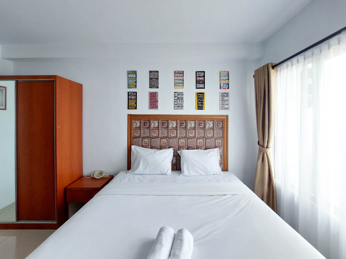 Bedroom 1, Good and Homey Studio at Skyview Medan Apartment By Travelio, Medan