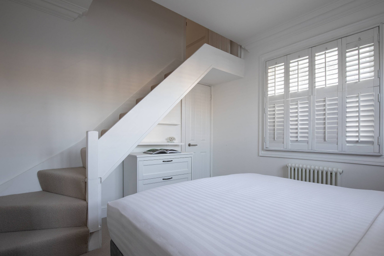 Bedroom 3, St Stephen's Gardens VII by Onefinestay, London
