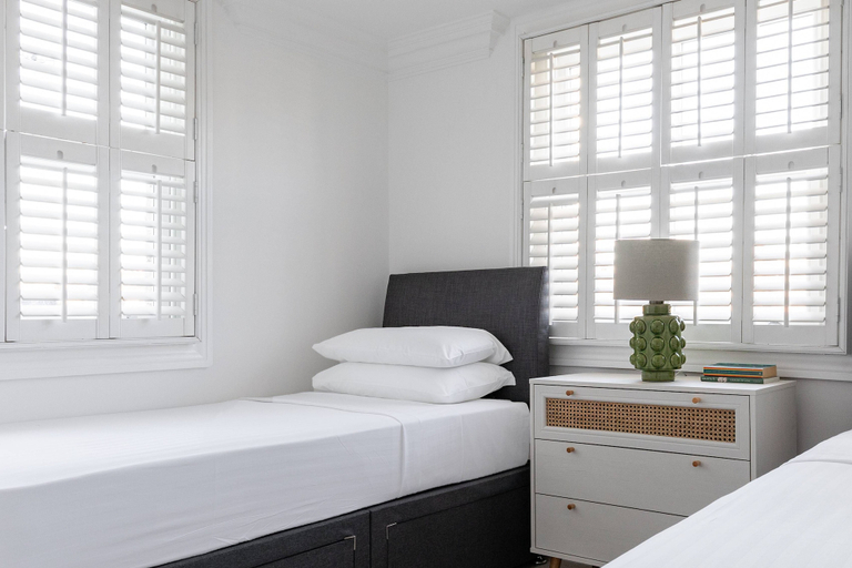Bedroom 4, St Stephen's Gardens VII by Onefinestay, London