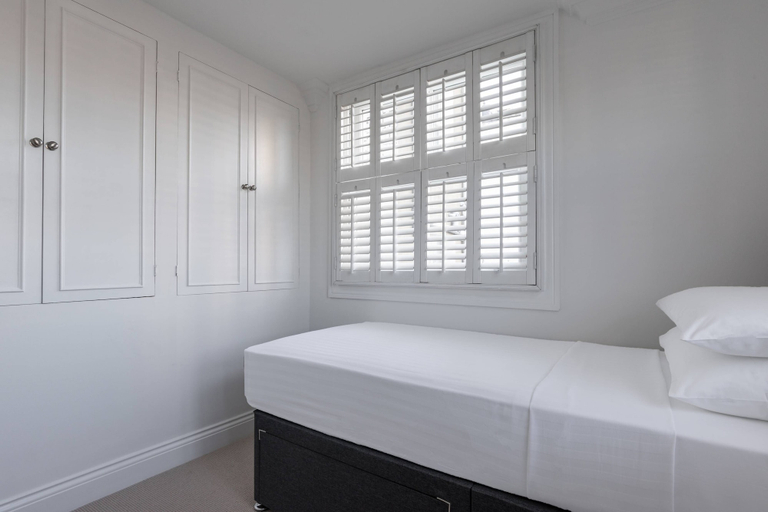 Bedroom 2, St Stephen's Gardens VII by Onefinestay, London