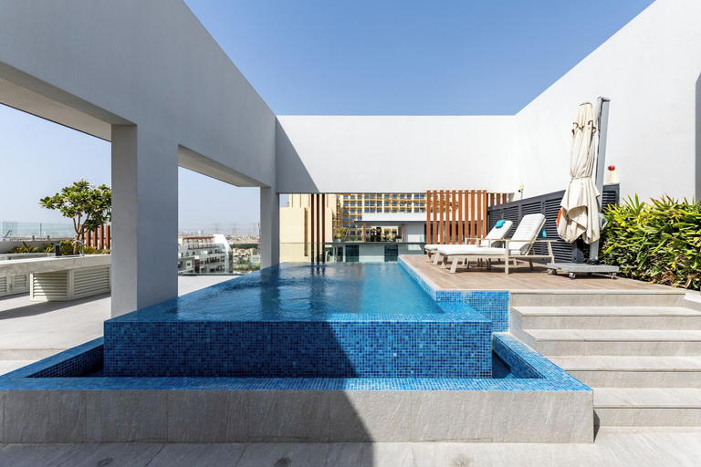 Outdoor pool 2, Waves - Tranquil Living 2BR Apt in JVC with City Views, Dubai