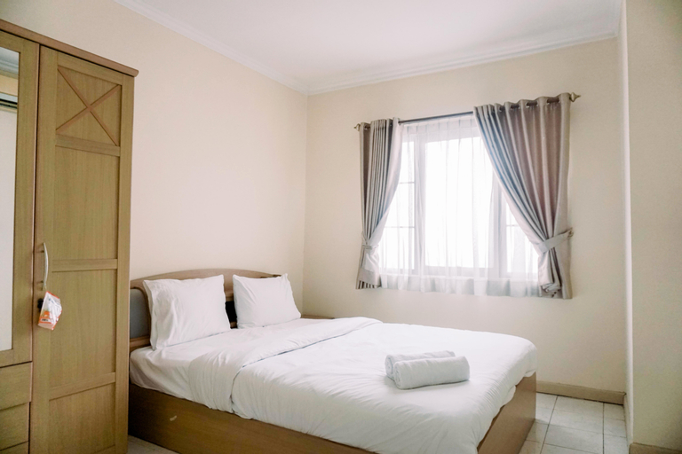 Elegant and Comfortable 2BR Puri Garden Apartment By Travelio, West Jakarta