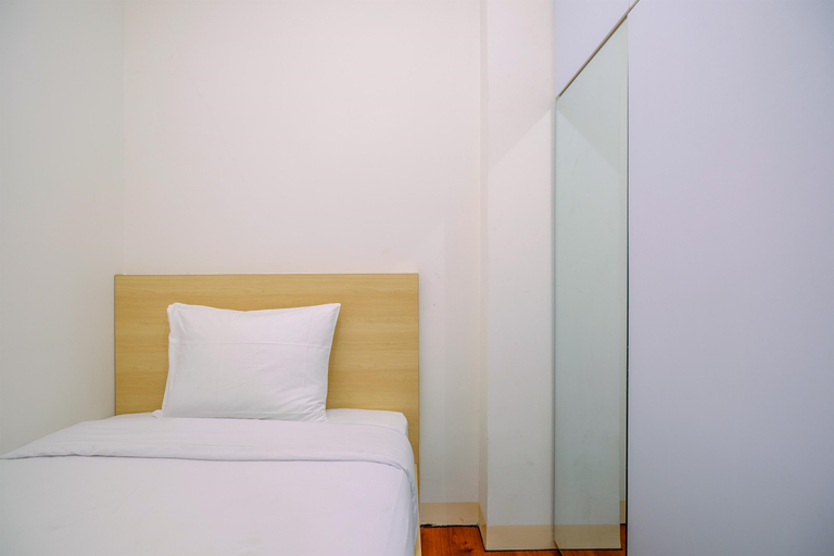 Bedroom 2, Cozy and Comfort Stay 2BR at Podomoro Golf View Apartment By Travelio, Bogor