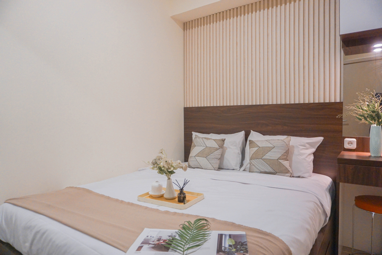 Bedroom 1, Warm and Modern Style 2BR at Meikarta Apartment By Travelio, Cikarang