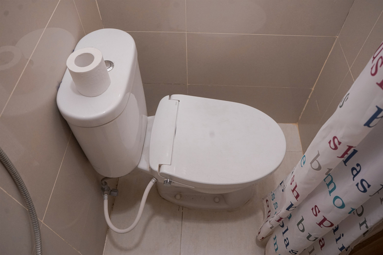 Bathroom 3, Good Compact Studio Apartment at B Residence By Travelio, Tangerang Selatan